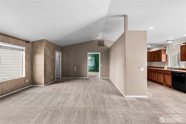 649 Sally Dr, Wenatchee, WA 98801 - unfurnished living room with baseboards, lofted ceiling, a sink, and light colored carpet
