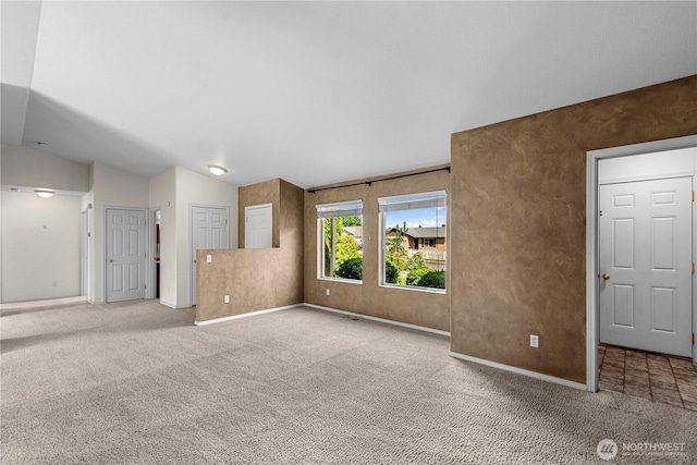 649 Sally Dr, Wenatchee, WA 98801 - unfurnished living room featuring carpet, vaulted ceiling, and baseboards
