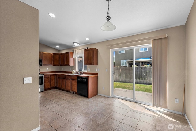 649 Sally Dr, Wenatchee, WA 98801 - kitchen with black dishwasher, stainless steel range with electric stovetop, baseboards, pendant lighting, and light countertops