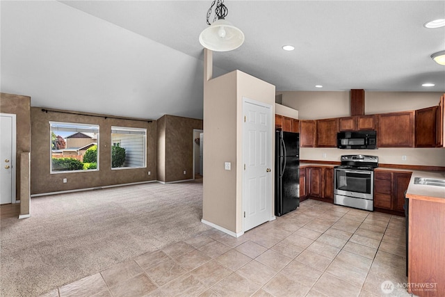 649 Sally Dr, Wenatchee, WA 98801 - kitchen with black appliances, vaulted ceiling, open floor plan, light colored carpet, and baseboards