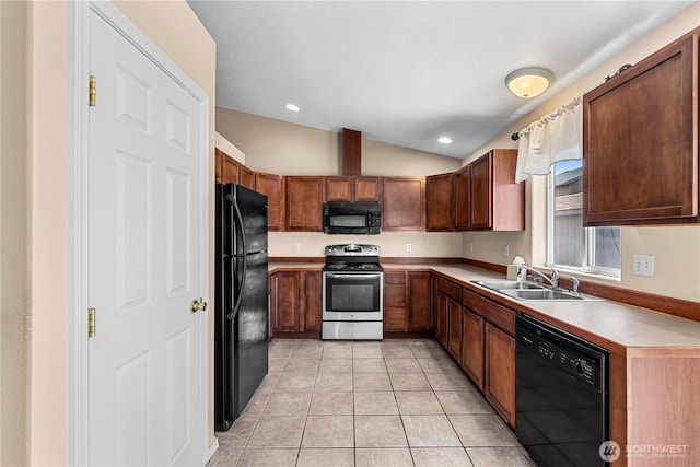 649 Sally Dr, Wenatchee, WA 98801 - kitchen featuring black appliances, a sink, vaulted ceiling, light tile patterned flooring, and light countertops