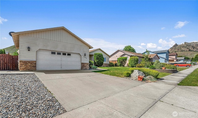 649 Sally Dr, Wenatchee, WA 98801 - view of front facade featuring stone siding and a garage