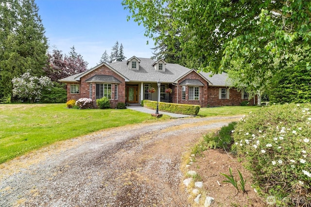 3341 Nicole Ln, Custer, WA 98240 - cape cod home with brick siding, a front lawn, and dirt driveway