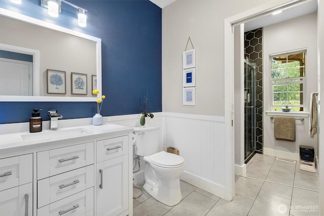 3341 Nicole Ln, Custer, WA 98240 - full bath with a shower stall, vanity, a wainscoted wall, toilet, and tile patterned flooring