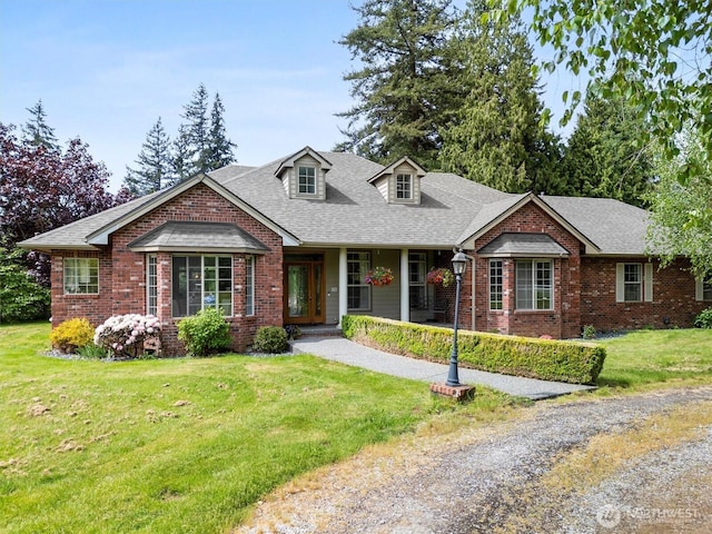 3341 Nicole Ln, Custer, WA 98240 - view of front of house featuring brick siding, a front lawn, and a shingled roof
