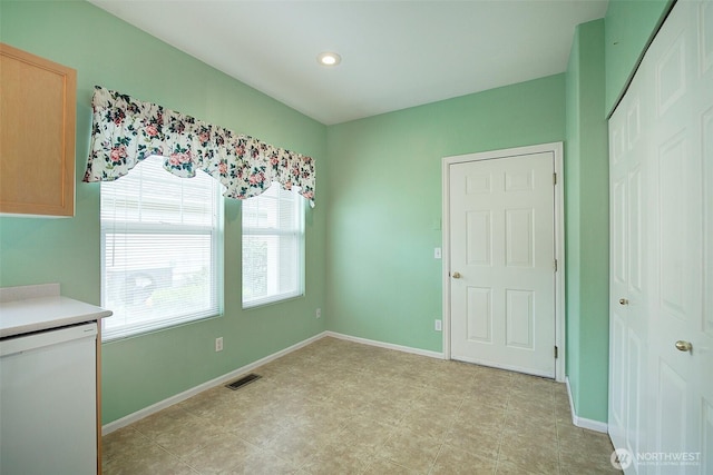 unfurnished dining area featuring baseboards and recessed lighting