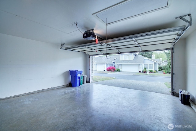garage featuring a garage door opener