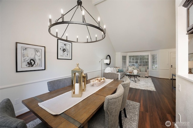 11635 NE 95th St, Kirkland, WA 98033 - dining area with high vaulted ceiling, a chandelier, dark wood-style floors, and baseboards