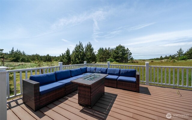 1011 231st Ln, Ocean Park, WA 98640 - wooden deck featuring an outdoor living space with a fire pit