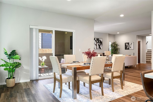 dining room featuring stairs, wood finished floors, recessed lighting, and baseboards