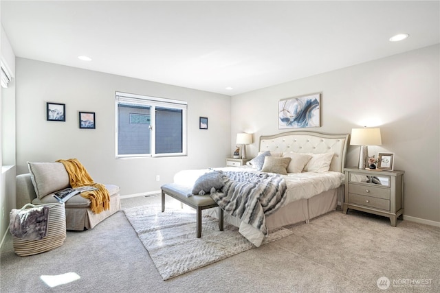 bedroom featuring light colored carpet, baseboards, and recessed lighting
