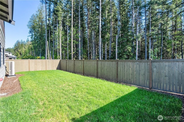 view of yard featuring central air condition unit