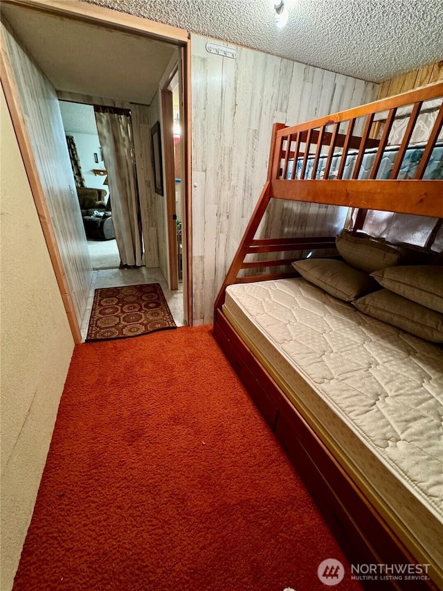 511 Old River Rd Unit 18, Naches, WA 98937 - carpeted bedroom with wooden walls and a textured ceiling