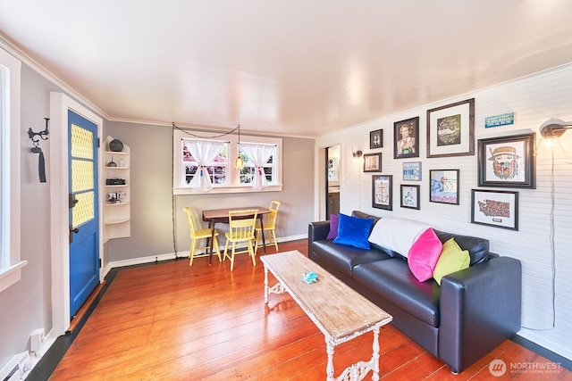 1214 Bay Ave, Ocean Park, WA 98640 - living area with crown molding, wood-type flooring, and baseboards