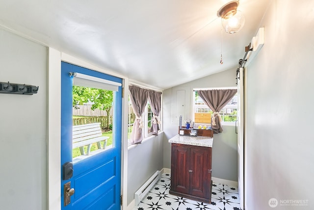 1214 Bay Ave, Ocean Park, WA 98640 - entryway featuring a baseboard radiator, lofted ceiling, baseboards, and light floors