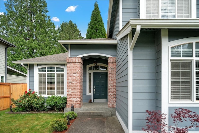 16260 11th Ave NE, Shoreline, WA 98155 - view of exterior entry with fence and roof with shingles