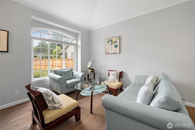 16260 11th Ave NE, Shoreline, WA 98155 - living area with healthy amount of natural light, crown molding, wood finished floors, baseboards, and lofted ceiling