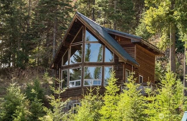 6166 Westside Rd, Cle Elum, WA 98922 - view of property exterior with a forest view and metal roof