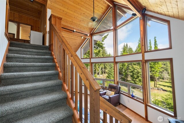 6166 Westside Rd, Cle Elum, WA 98922 - stairway with wooden ceiling, healthy amount of natural light, wood finished floors, and high vaulted ceiling