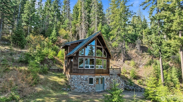 6166 Westside Rd, Cle Elum, WA 98922 - rear view of property with a wooded view and stone siding