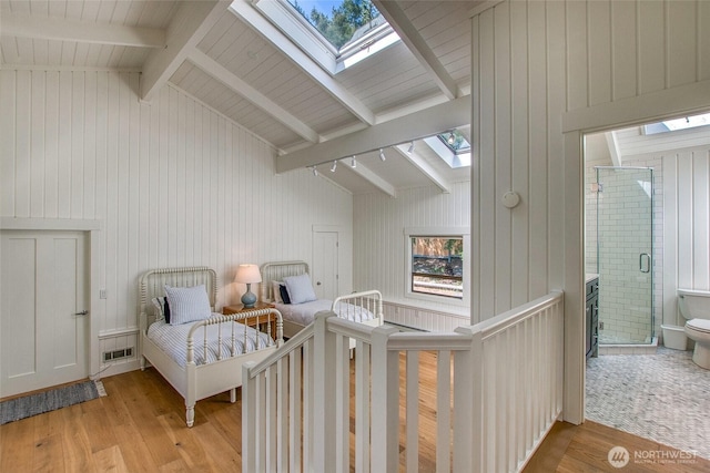 376 Killebrew Lake Rd, Orcas Island, WA 98280 - bedroom with a skylight, light wood-style floors, and multiple windows