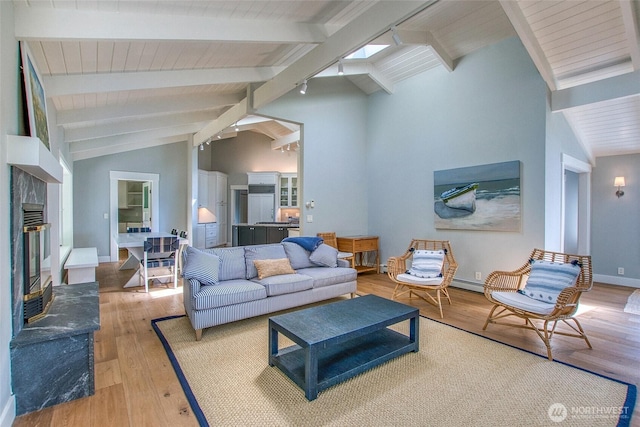 376 Killebrew Lake Rd, Orcas Island, WA 98280 - living area featuring wood-type flooring, a glass covered fireplace, and baseboards