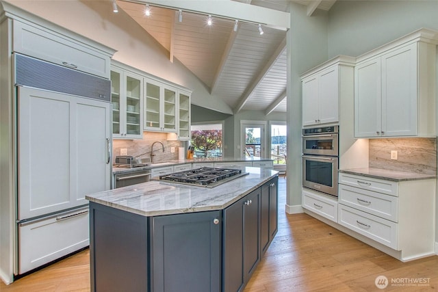 376 Killebrew Lake Rd, Orcas Island, WA 98280 - kitchen with stainless steel appliances, track lighting, light wood-style flooring, white cabinets, and wooden ceiling