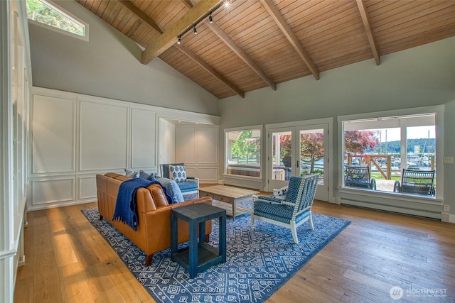 376 Killebrew Lake Rd, Orcas Island, WA 98280 - sunroom / solarium with track lighting, plenty of natural light, a baseboard radiator, and french doors