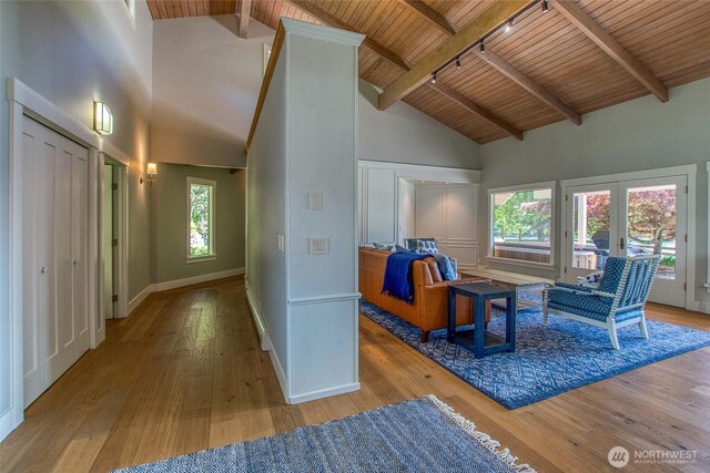 376 Killebrew Lake Rd, Orcas Island, WA 98280 - interior space featuring wood ceiling, hardwood / wood-style floors, high vaulted ceiling, beamed ceiling, and baseboards