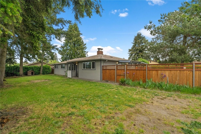 back of property featuring a chimney