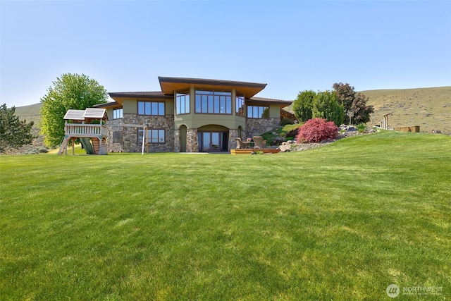 1041 Red Sky Dr, Yakima, WA 98903 - back of property featuring stone siding, a yard, stairway, and a balcony