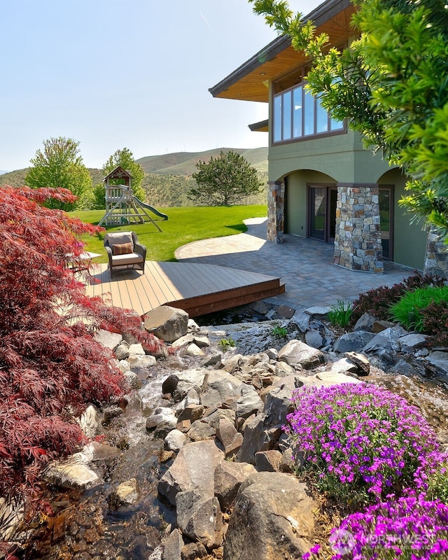 1041 Red Sky Dr, Yakima, WA 98903 - deck with a yard, a playground, and a patio
