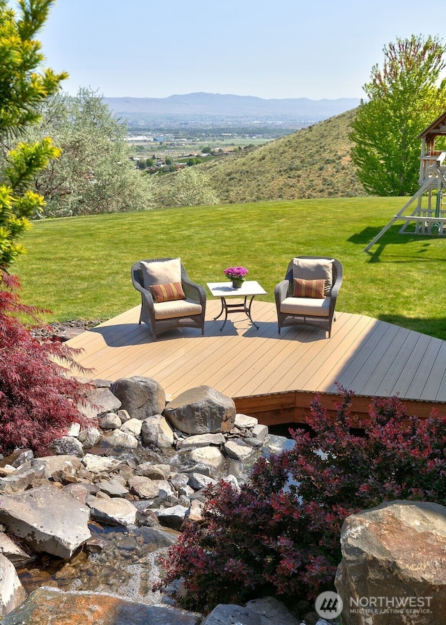 1041 Red Sky Dr, Yakima, WA 98903 - wooden deck featuring a playground, a mountain view, and a yard