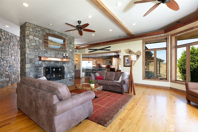 1041 Red Sky Dr, Yakima, WA 98903 - living area with ceiling fan, light wood-type flooring, a stone fireplace, baseboards, and recessed lighting