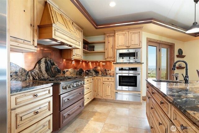 1041 Red Sky Dr, Yakima, WA 98903 - kitchen with appliances with stainless steel finishes, a warming drawer, a sink, custom exhaust hood, and backsplash