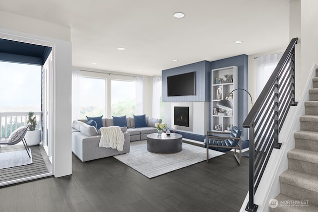 living room with healthy amount of natural light, stairway, dark wood-type flooring, built in features, and recessed lighting