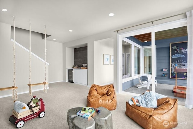 living area featuring carpet flooring, recessed lighting, wine cooler, baseboards, and french doors