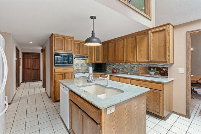 14413 139th Ave SE, Snohomish, WA 98290 - kitchen with black microwave, light tile patterned flooring, decorative backsplash, brown cabinets, and recessed lighting