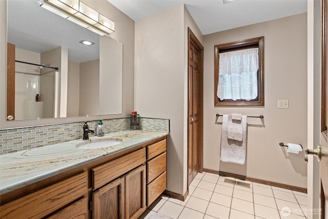 14413 139th Ave SE, Snohomish, WA 98290 - bathroom with vanity, backsplash, a shower, and tile patterned floors