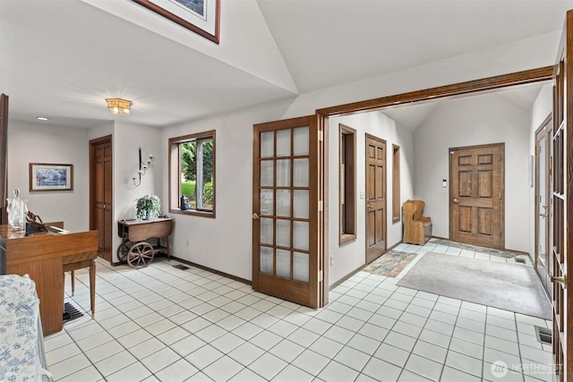 14413 139th Ave SE, Snohomish, WA 98290 - entrance foyer featuring vaulted ceiling, light tile patterned floors, french doors, and baseboards