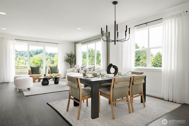 dining room with healthy amount of natural light, dark wood finished floors, a chandelier, and recessed lighting