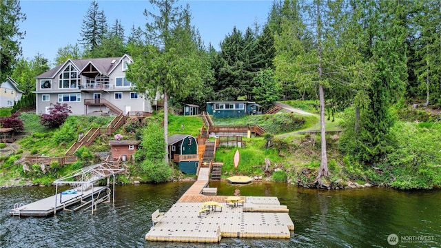 dock featuring stairs and a water view