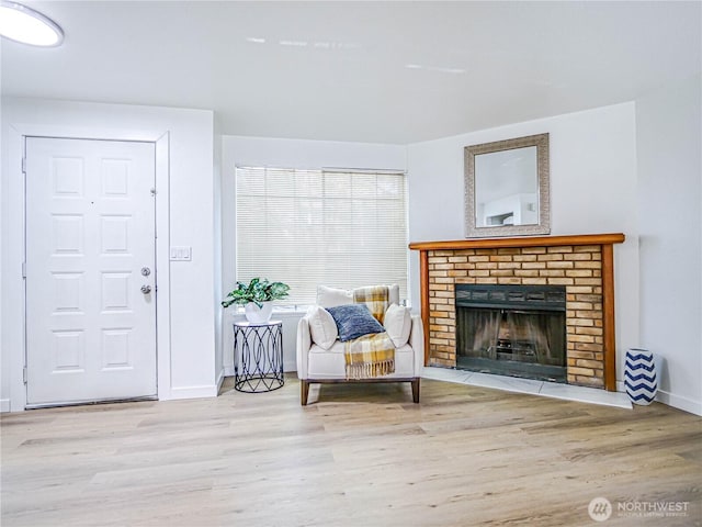 8407 18th Ave W Unit 4-102, Everett, WA 98204 - sitting room featuring wood finished floors, baseboards, and a brick fireplace