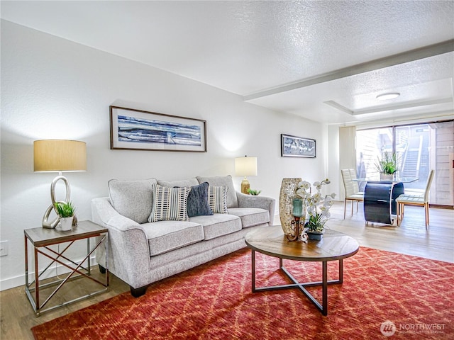 8407 18th Ave W Unit 4-102, Everett, WA 98204 - living room with wood finished floors, baseboards, and a textured ceiling