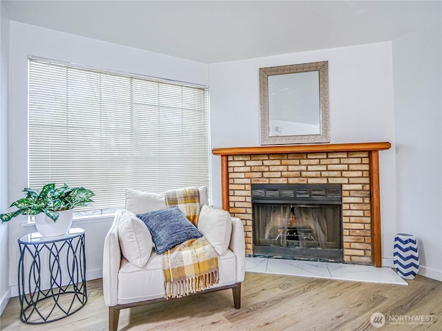 8407 18th Ave W Unit 4-102, Everett, WA 98204 - sitting room with wood finished floors, a fireplace, and baseboards