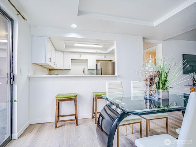 8407 18th Ave W Unit 4-102, Everett, WA 98204 - dining space with light wood-type flooring and baseboards