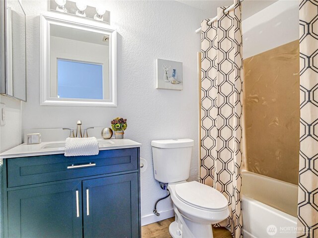 8407 18th Ave W Unit 4-102, Everett, WA 98204 - full bath with toilet, vanity, wood finished floors, shower / tub combo with curtain, and baseboards