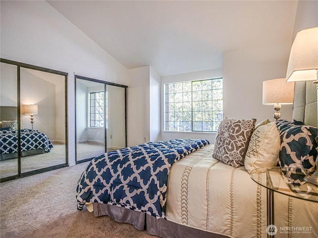 8407 18th Ave W Unit 4-102, Everett, WA 98204 - bedroom with multiple closets, carpet flooring, and vaulted ceiling