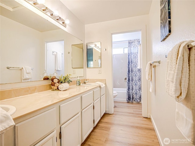 8407 18th Ave W Unit 4-102, Everett, WA 98204 - bathroom with wood finished floors, toilet, vanity, shower / bath combo, and baseboards