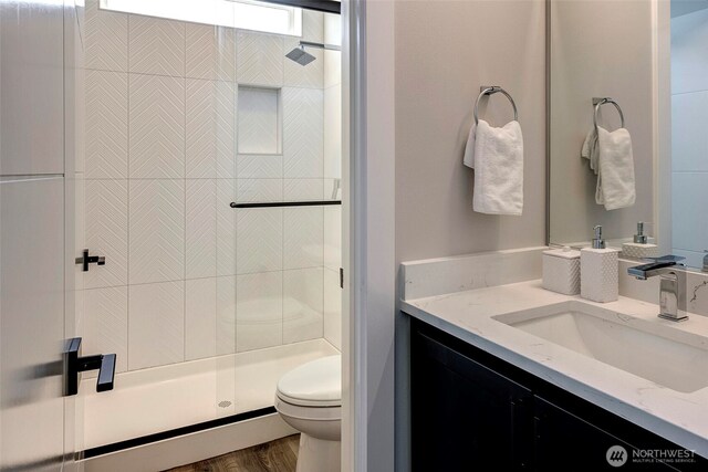 16215 Simonds Rd NE Unit 3, Kenmore, WA 98028 - bathroom with toilet, a shower stall, vanity, and wood finished floors